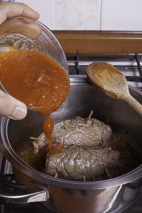 Pour the tomato puree...