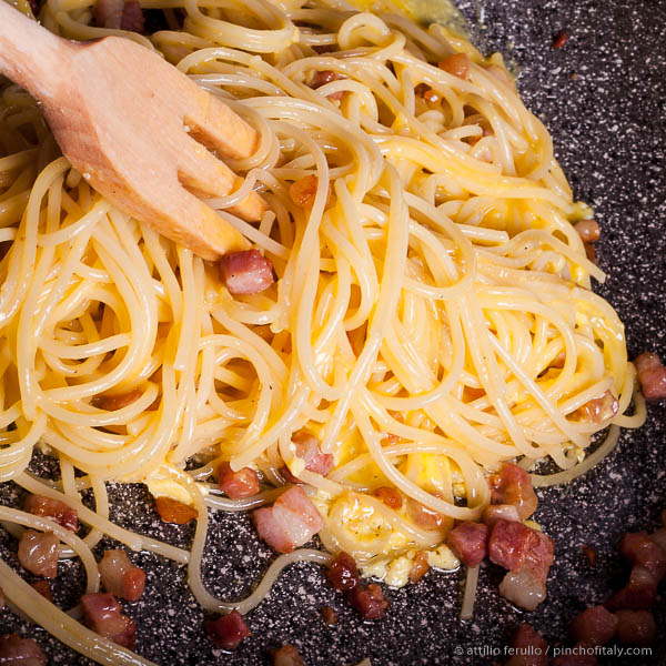 Turn With A Wooden Fork Until Spaghetti, Bacon And Eggs Are Well Mixed... Spaghetti Mixed