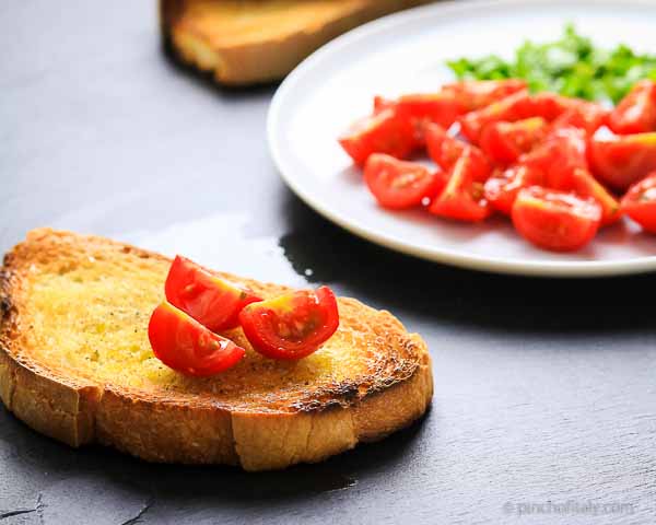 Add the Pieces of Cherry Tomatoes on The Bread... Italian Bread With Tomatoes