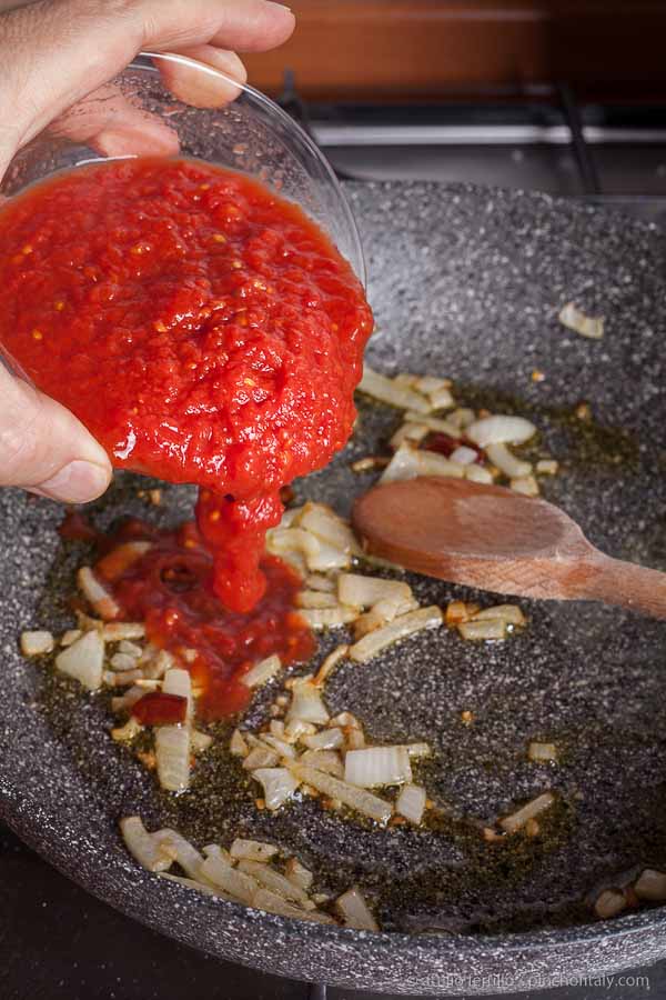 Pour the can crushed tomato in the sauce pan... Pour the can crushed tomato in the sauce pan...